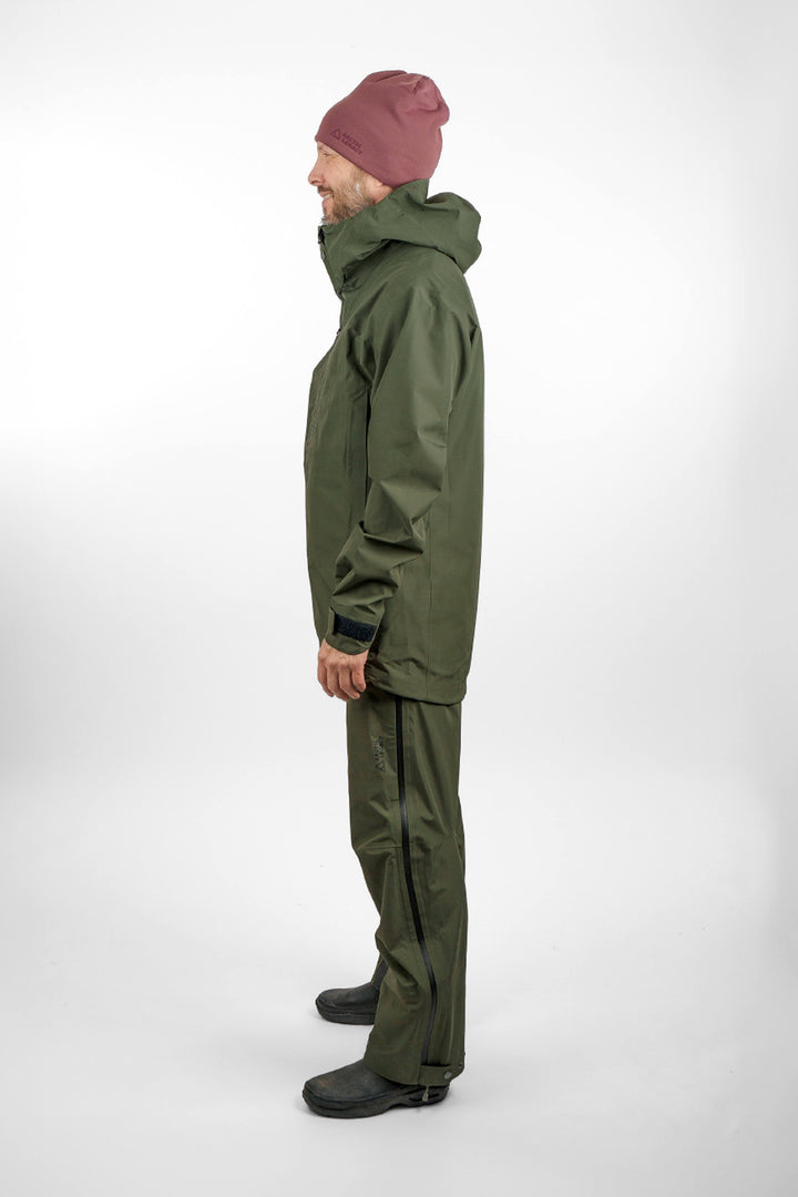 Green hardshell jacket in unisex sizing - side view full body of the Arctic Legacy Nuka Elements 3 layer Jacket#color_dusty-olive