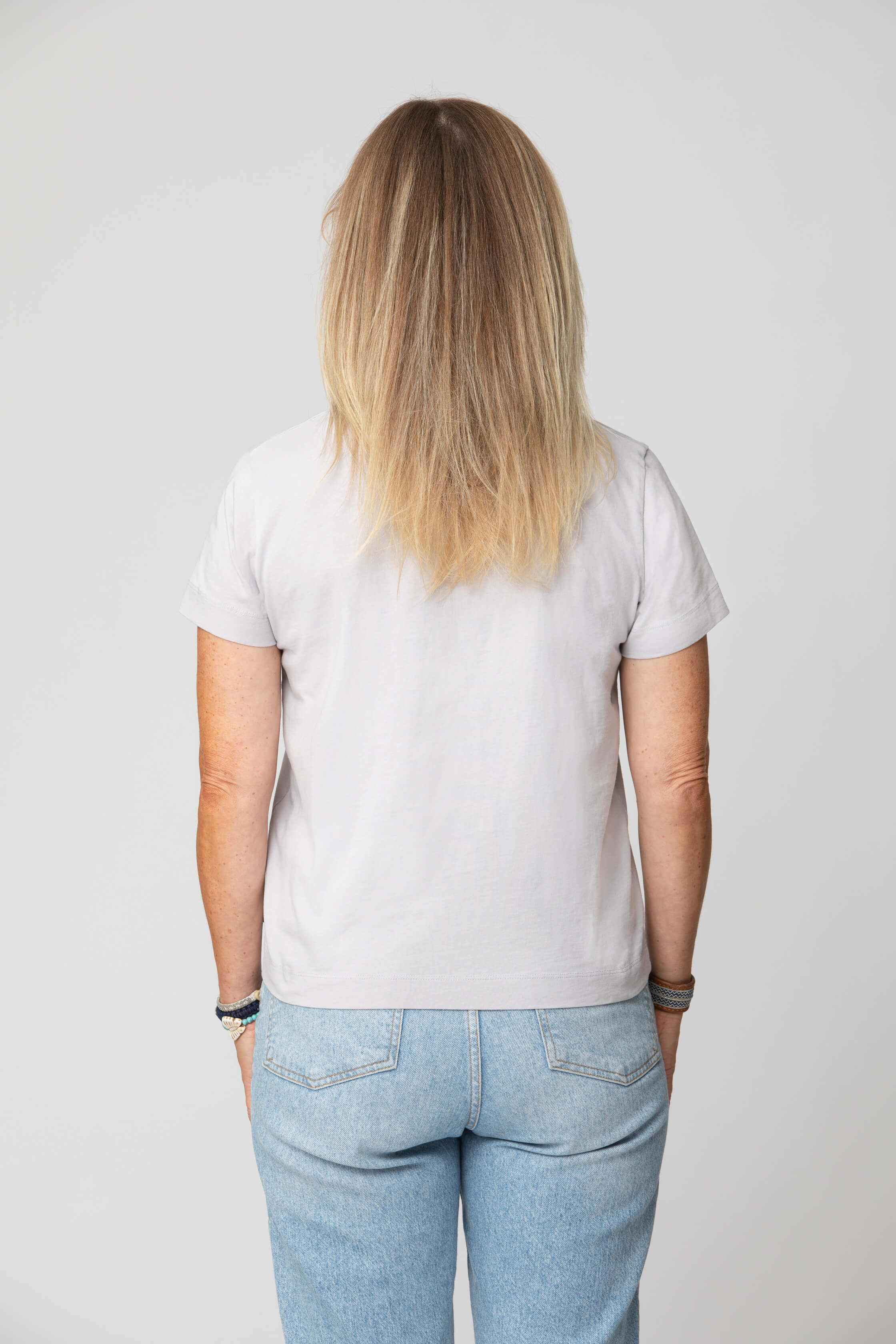 Women's grey t-shirt - back view of the Arctic Legacy Milo Organic Tee#color_northern-droplet