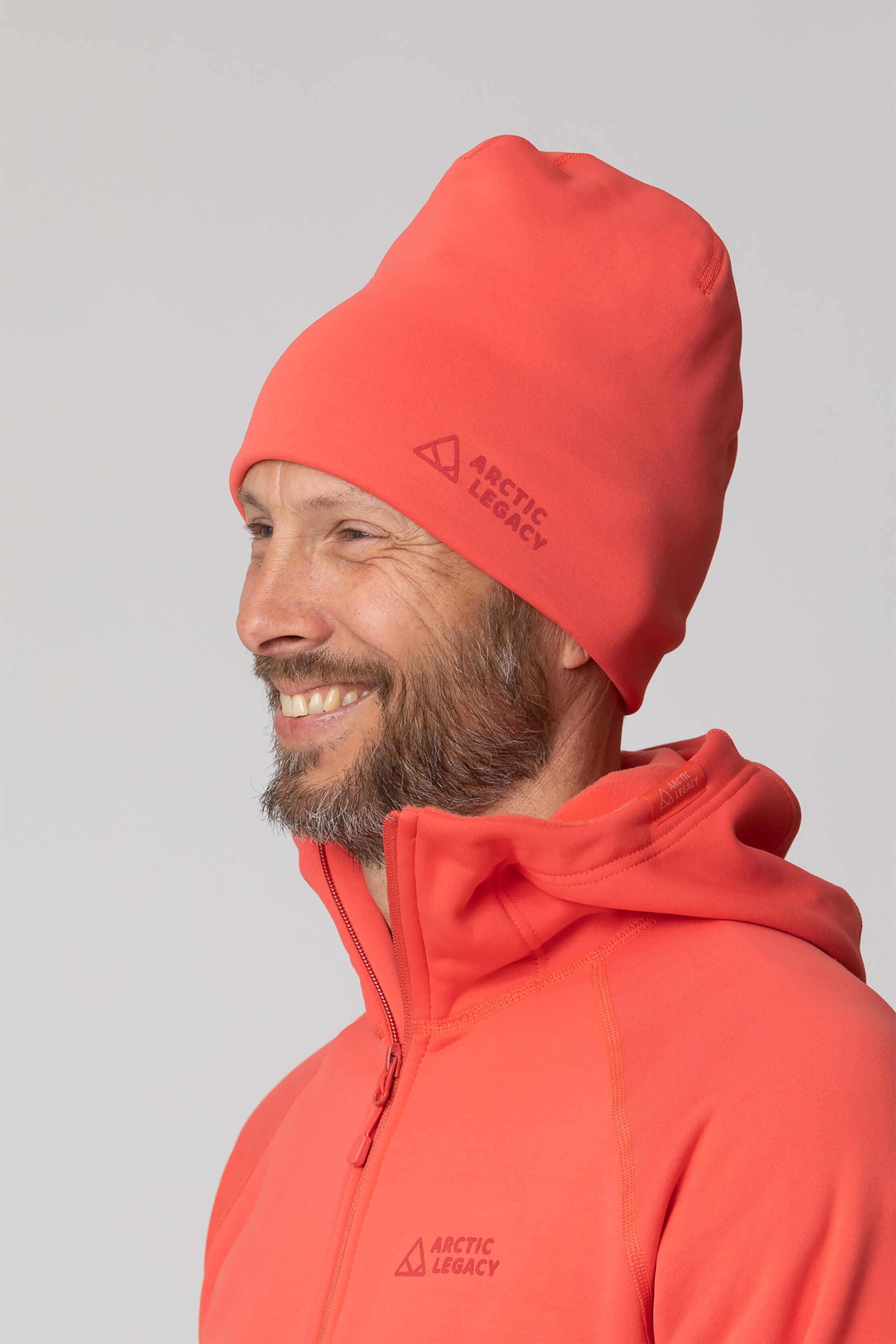 Pink red fleece hat - side view of the Arctic Legacy Nova Dual Layer Beanie#color_cayenne