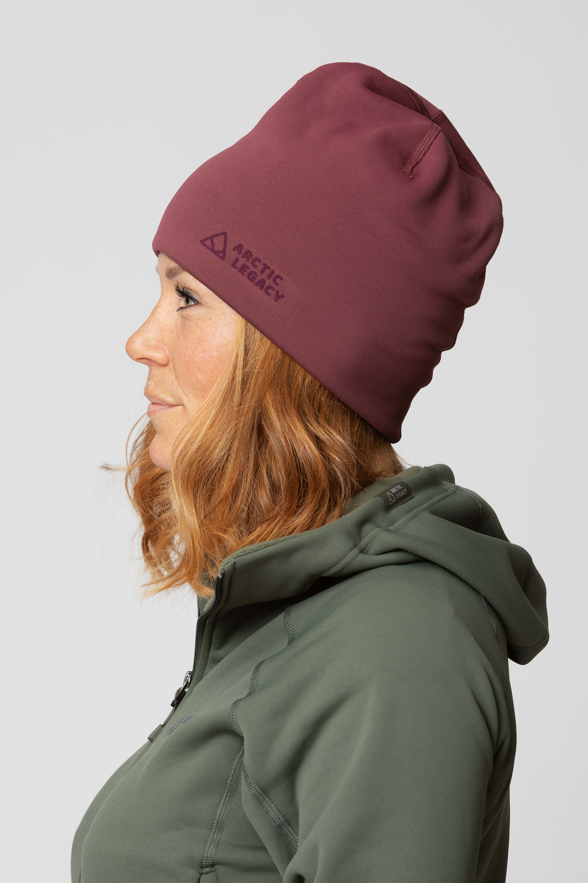 Purple fleece hat - side view of the Arctic Legacy Nova Dual Layer Beanie#color_crushed-berry