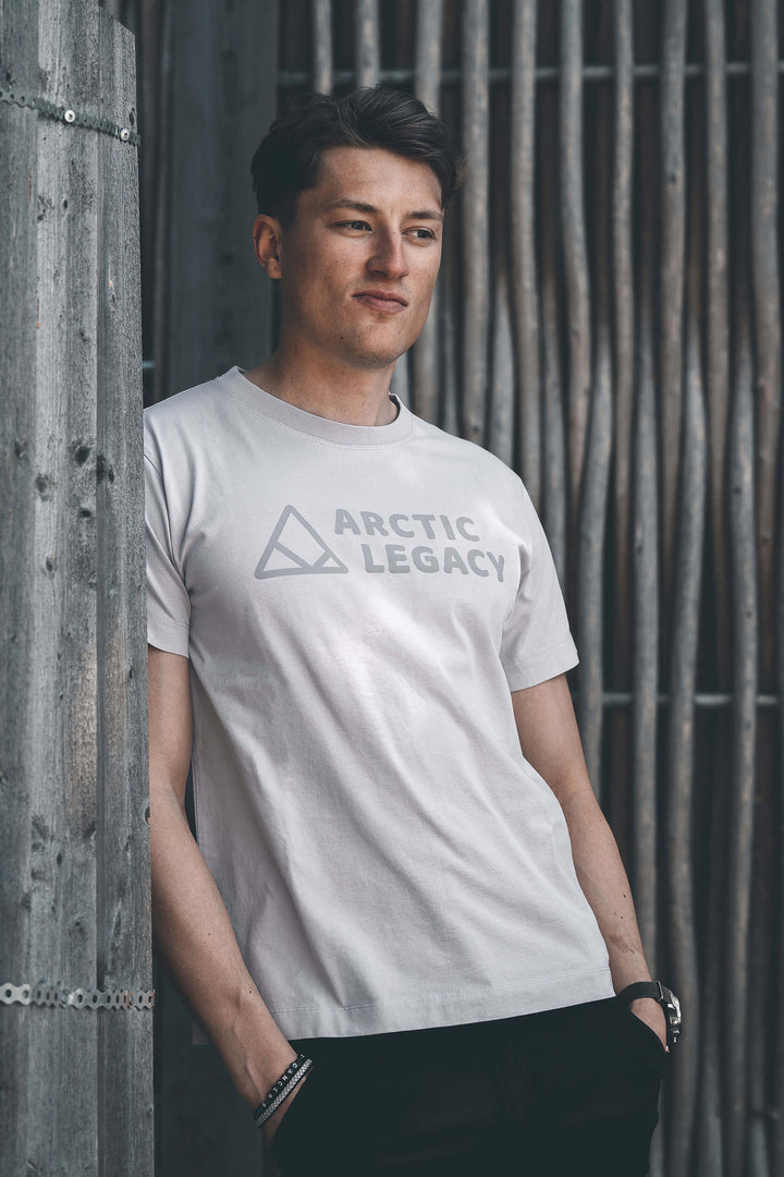 Men's grey t-shirt - front view of the Arctic Legacy Milo Organic Tee#color_northern-droplet