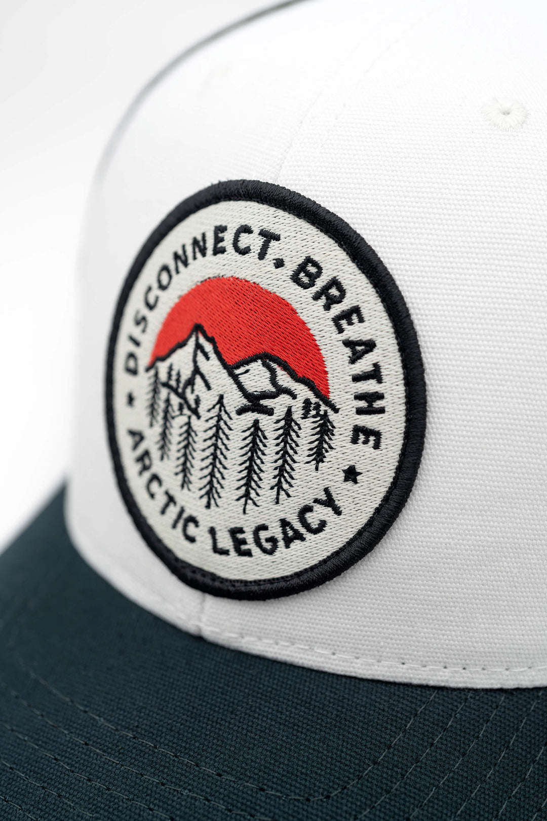 Blue and Off White trucker hat - closeup view of the Arctic Legacy Europe Trucker Hat#color_night-blue-off-white-black