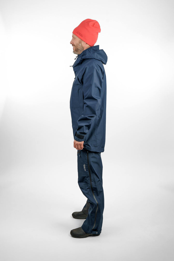 Blue hardshell jacket and pants in unisex sizing - side view of the Arctic Legacy Nuka Elements 3 layer jacket and pants#color_total-eclipse