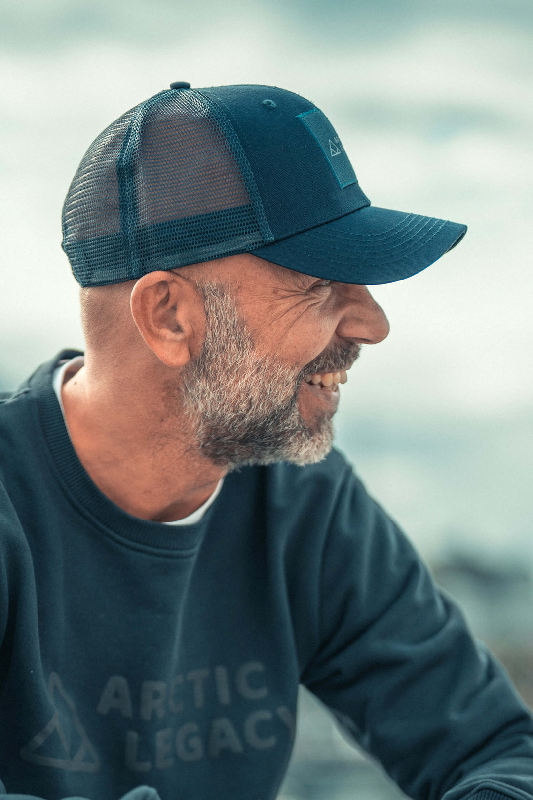 Blue trucker hat - side view of the Arctic Legacy Cypress Trucker#color_total-eclipse