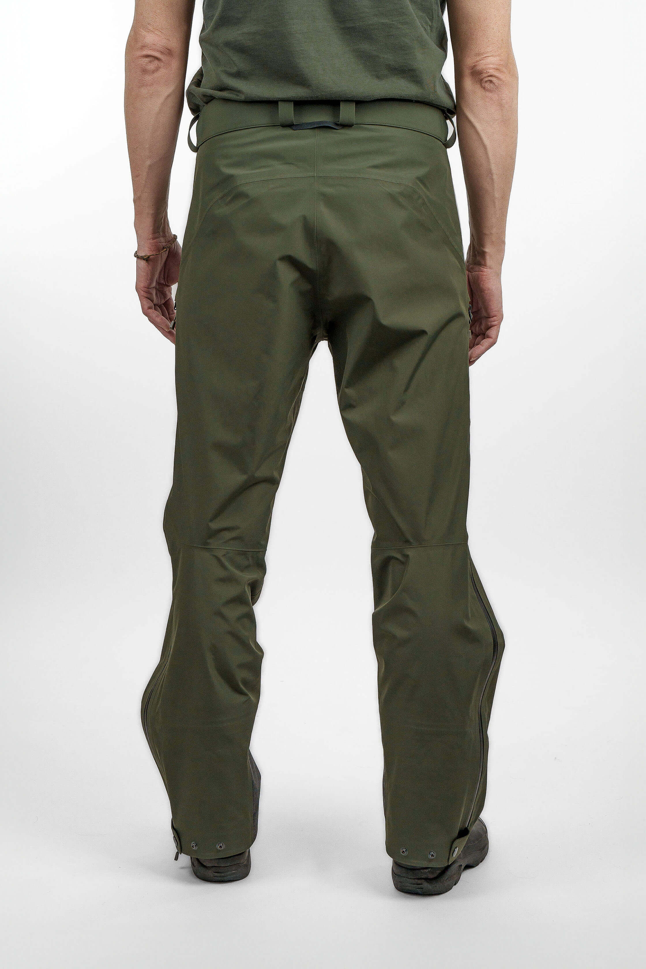 Green hardshell pants in unisex sizing - back view of the Arctic Legacy Nuka Elements 3 layer Pants#color_dusty-olive