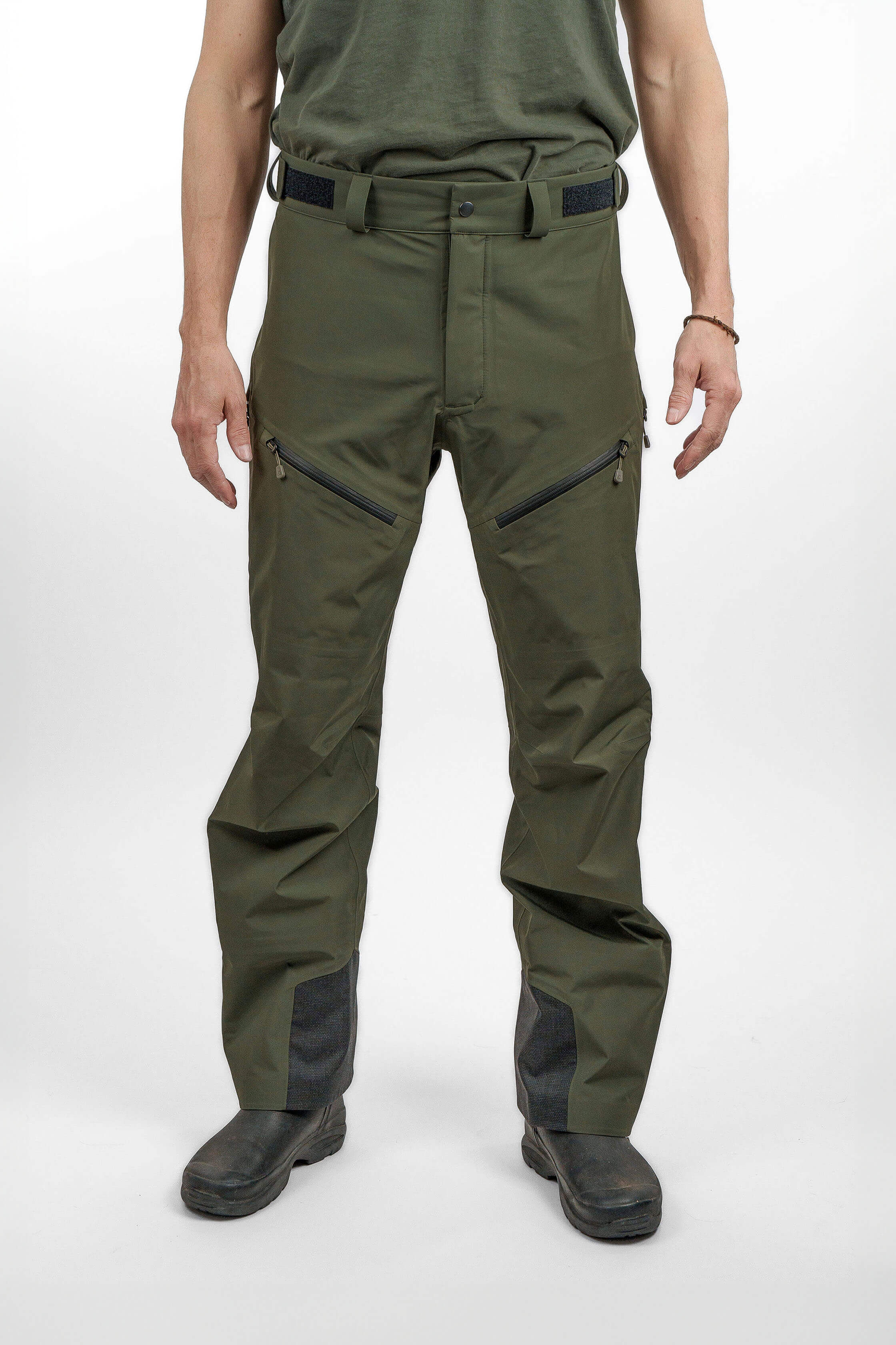 Green hardshell pants in unisex sizing - front view of the Arctic Legacy Nuka Elements 3 layer Pants#color_dusty-olive
