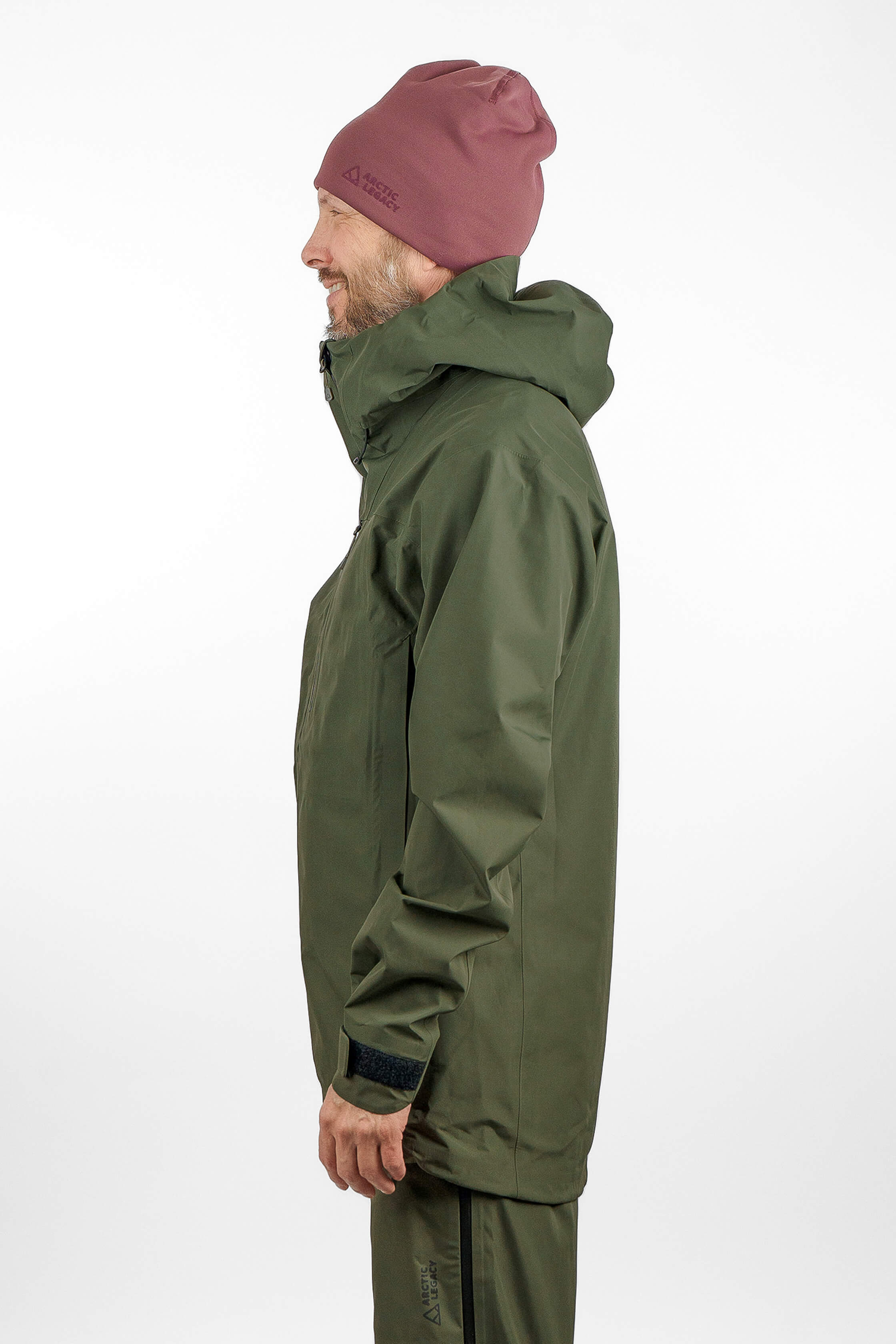 Green hardshell jacket in unisex sizing - side view of the Arctic Legacy Nuka Elements 3 layer Jacket#color_dusty-olive