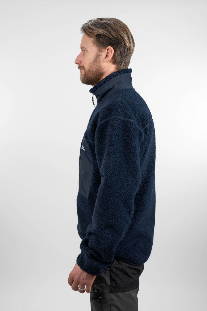 Men's blue pile fleece jacket - side view of the Arctic Legacy Kima Explorer Pile Jacket#color_indigo-blue