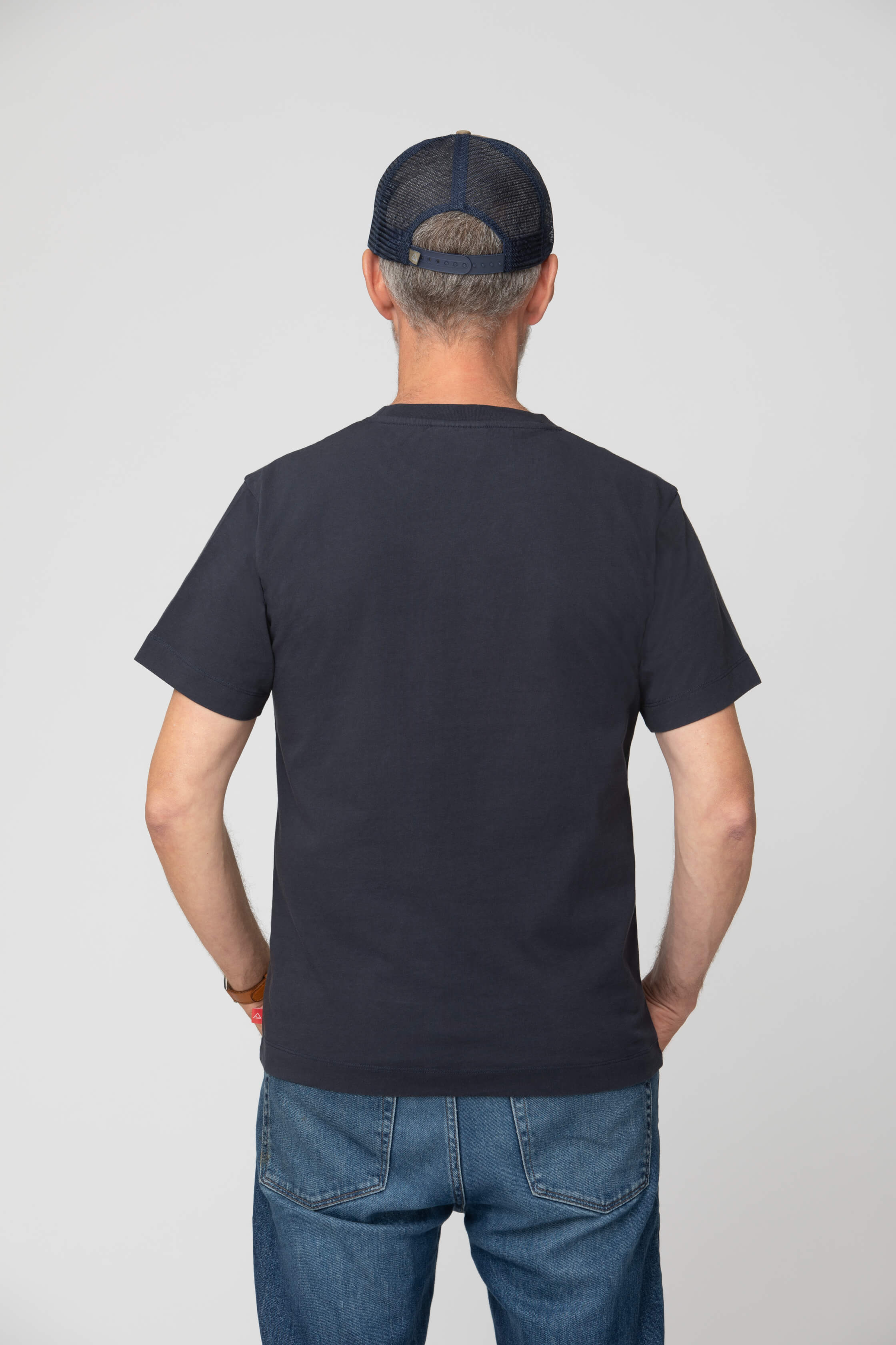Men's blue t-shirt - back view of the Arctic Legacy Milo Organic Tee#color_dark-navy