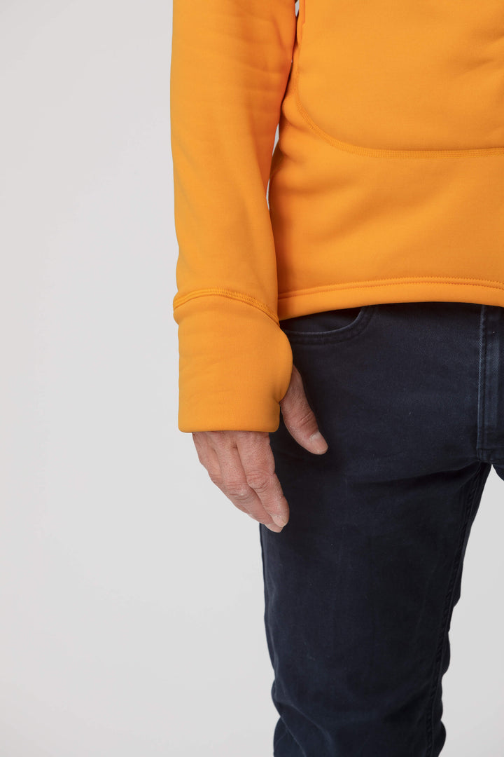 Men's orange yellow fleece jacket - wrist view of the Arctic Legacy Nanuk Pro Fleece Hoodie#color_zinnia