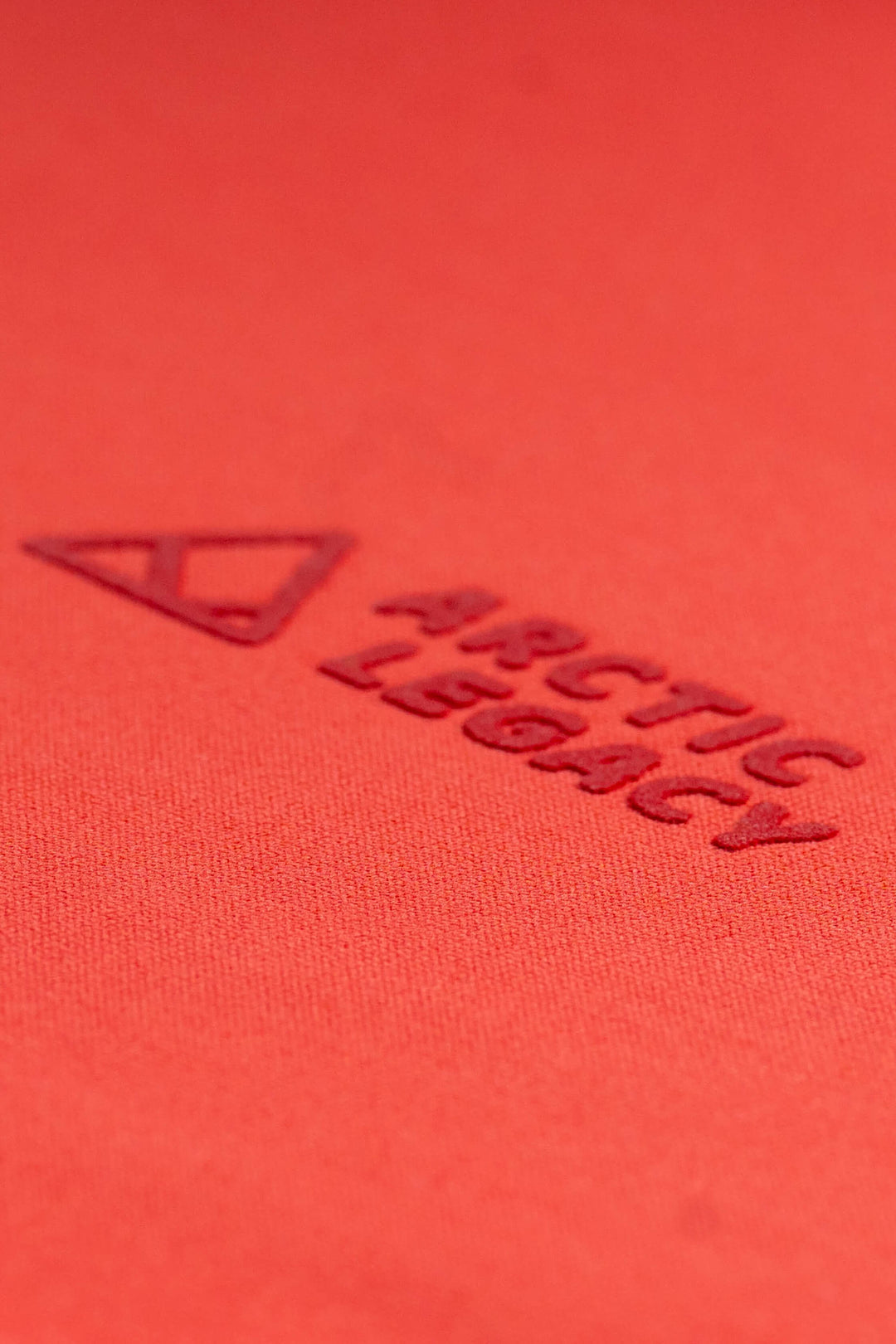 Women's pink red fleece jacket - close-up view of the Arctic Legacy Nanuk Pro Fleece Hoodie#color_cayenne
