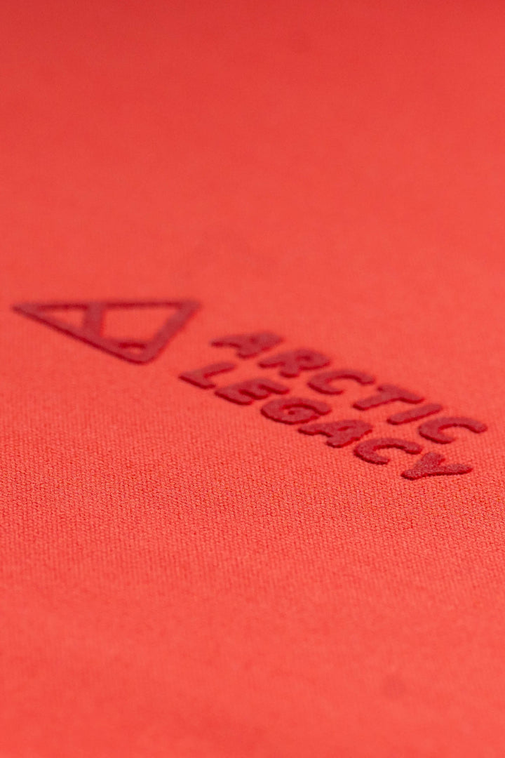 Women's pink red fleece jacket - close-up view of the Arctic Legacy Nanuk Pro Fleece Hoodie#color_cayenne