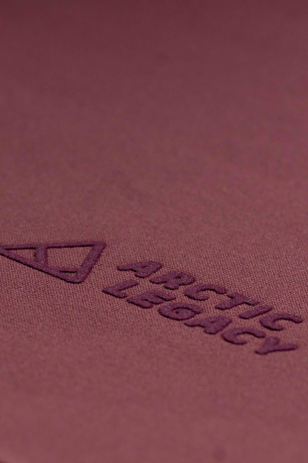 Women's purple fleece jacket - close-up view of the Arctic Legacy Nanuk Pro Fleece Hoodie#color_crushed-berry
