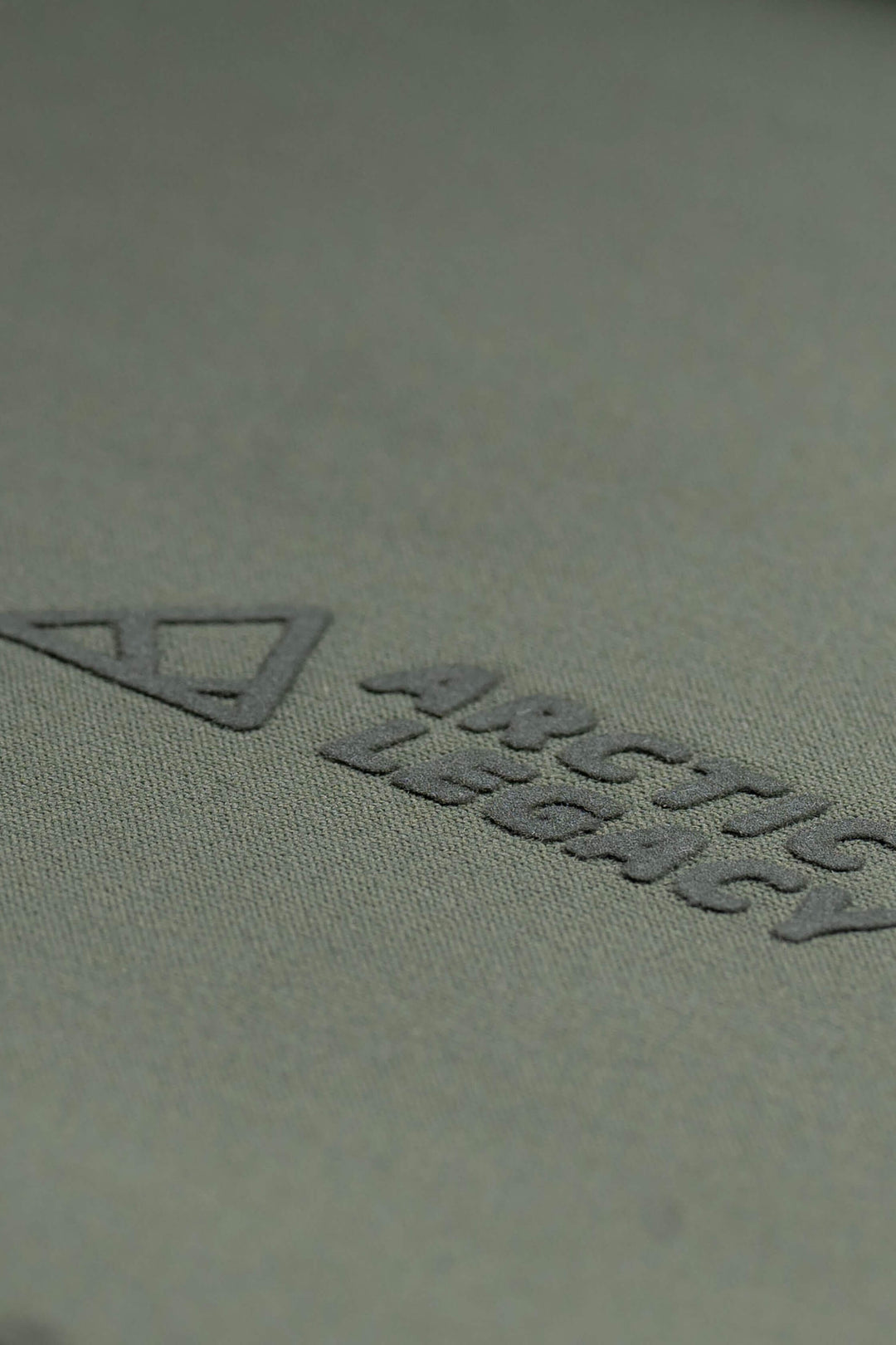 Women's green fleece jacket - close-up view of the Arctic Legacy Nanuk Pro Fleece Hoodie#color_dusty-olive