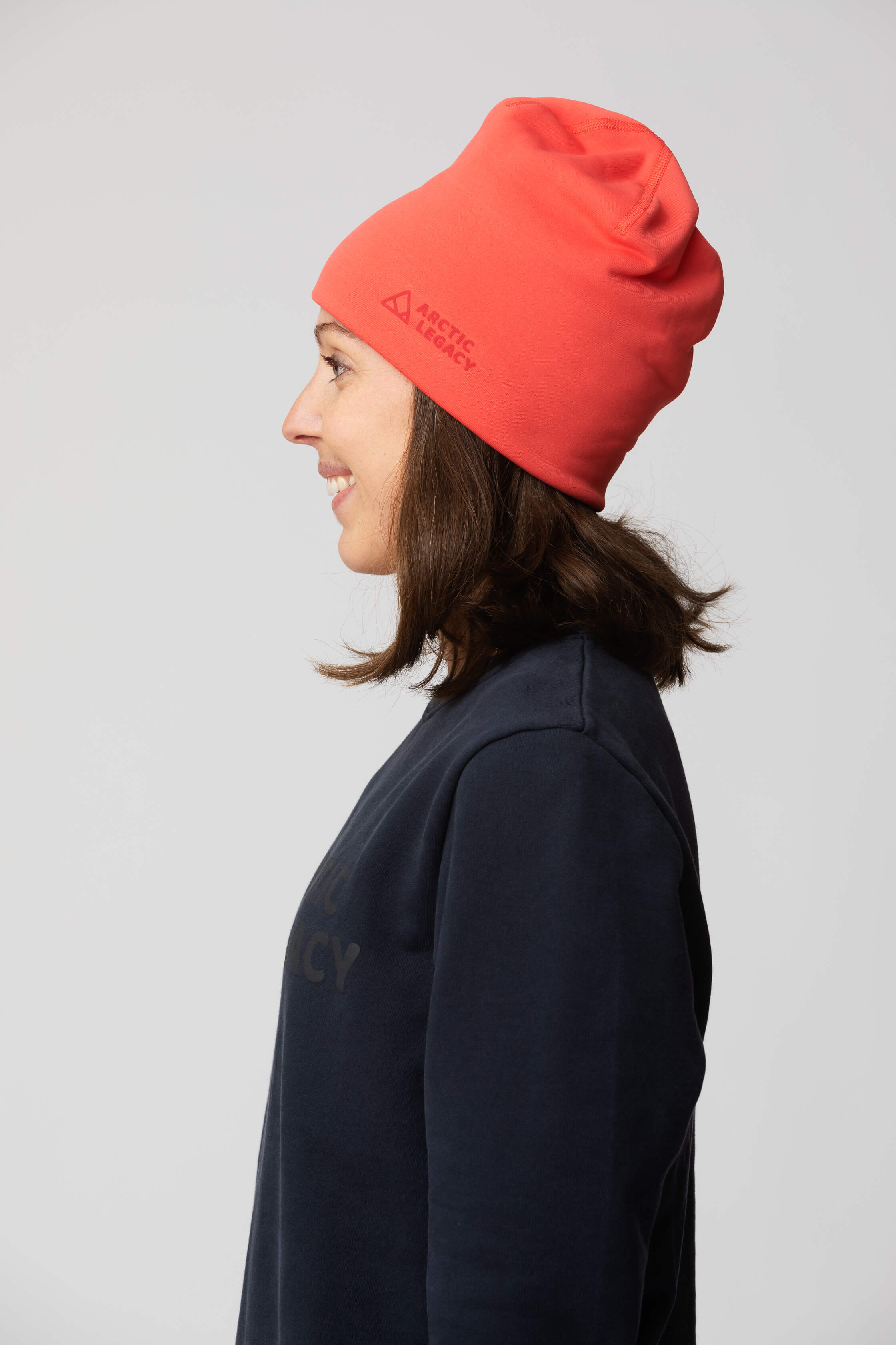 Pink red fleece hat - side view of the Arctic Legacy Nova Dual Layer Beanie#color_cayenne