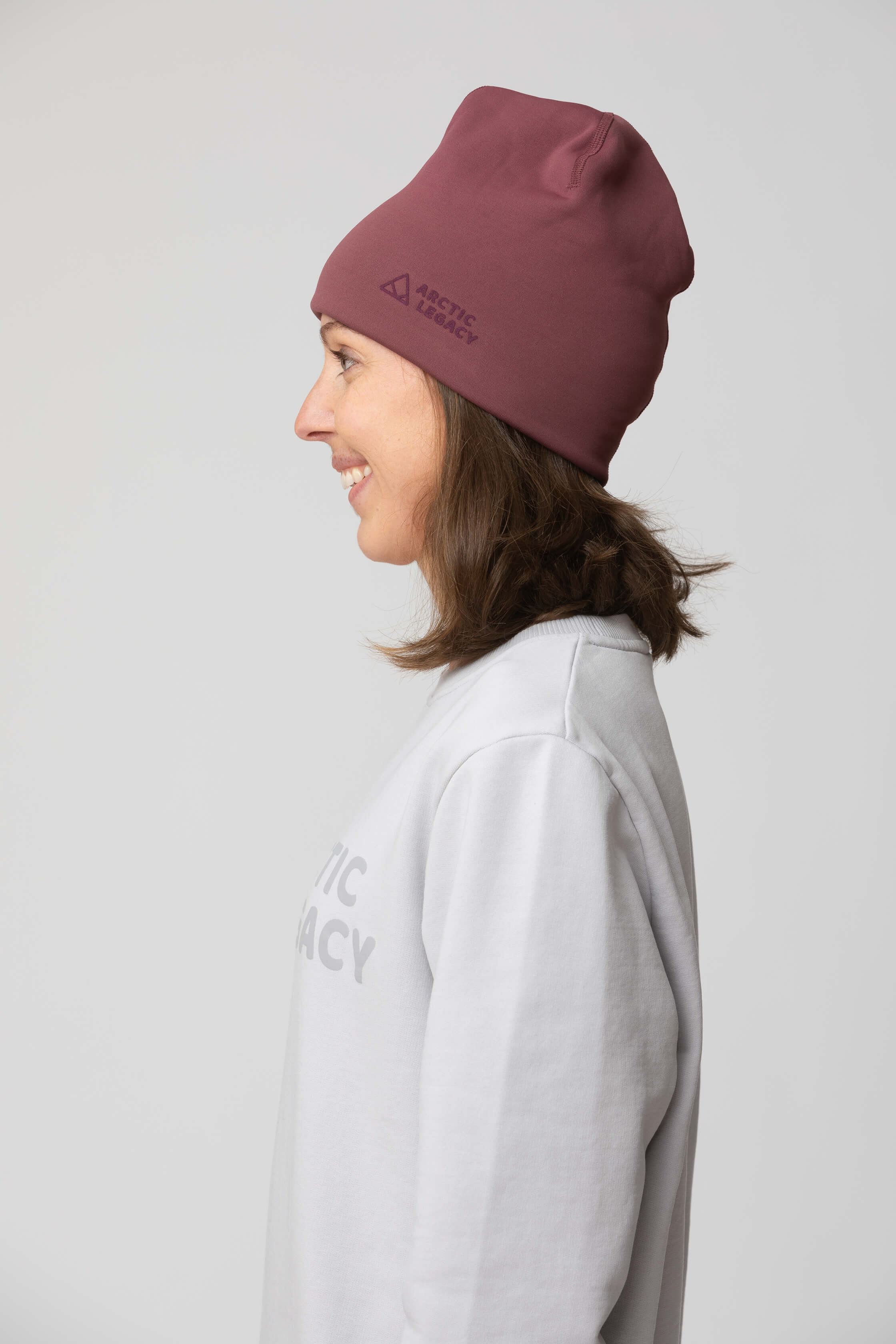 Purple fleece hat - side view of the Arctic Legacy Nova Dual Layer Beanie#color_crushed-berry