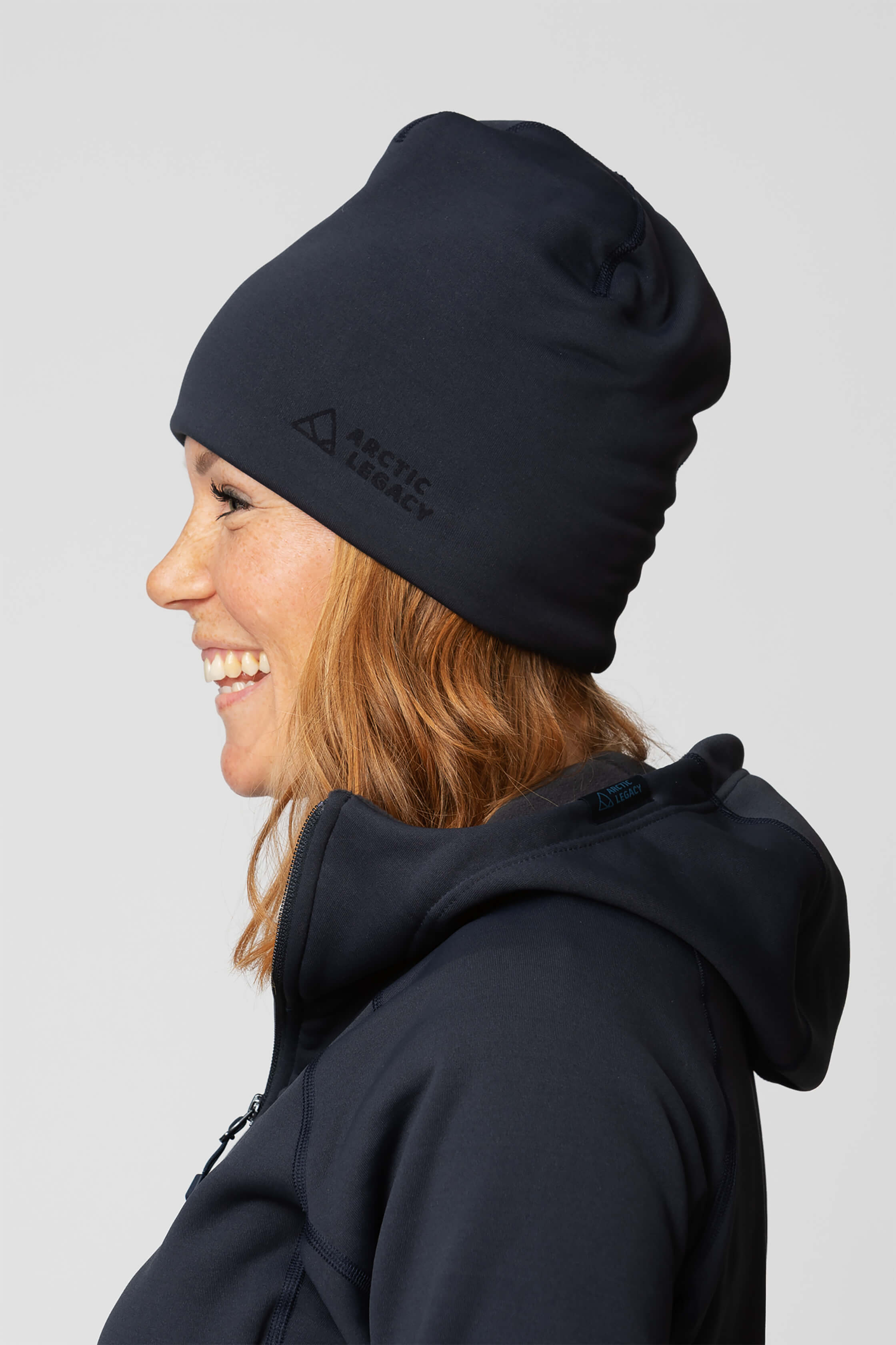 Blue fleece hat - side view of the Arctic Legacy Nova Dual Layer Beanie#color_total-eclipse-dark-blue