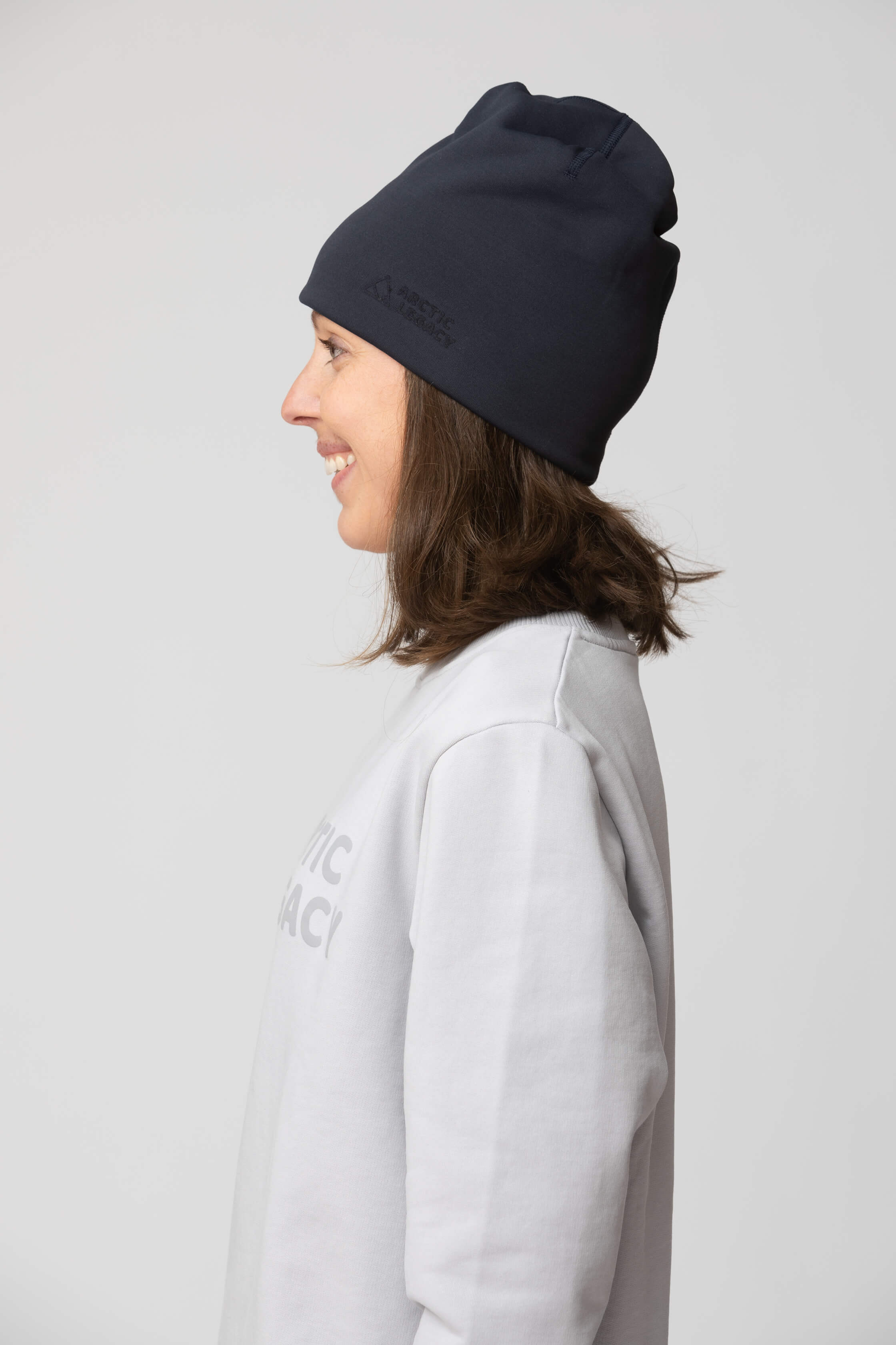 Blue fleece hat - side view of the Arctic Legacy Nova Dual Layer Beanie#color_total-eclipse-dark-blue