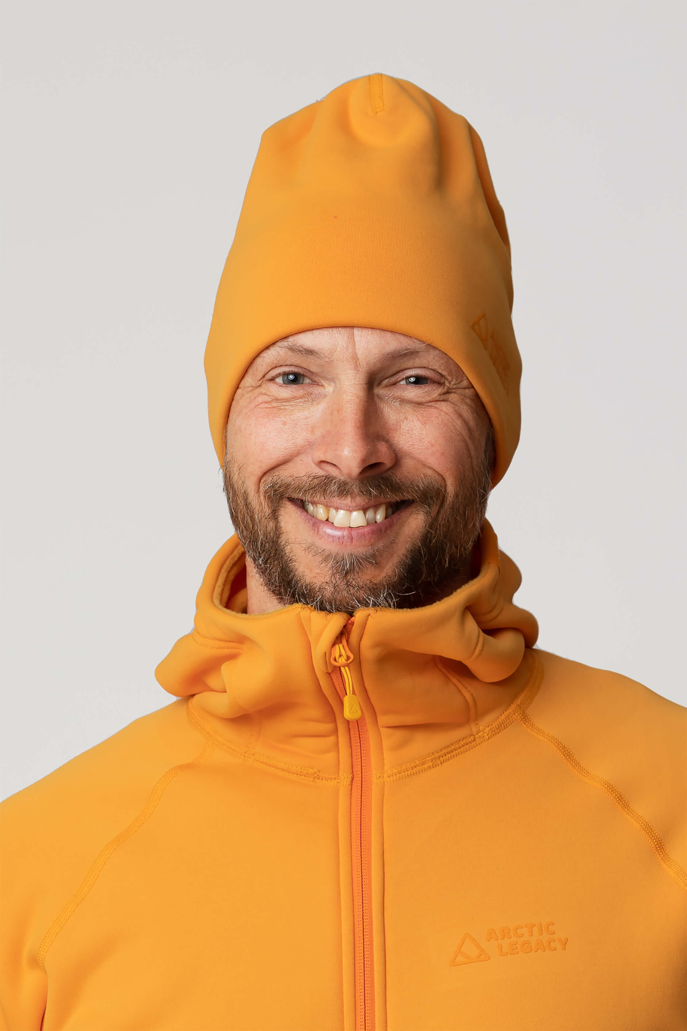 Orange yellow fleece hat - front view of the Arctic Legacy Nova Dual Layer Beanie#color_zinnia