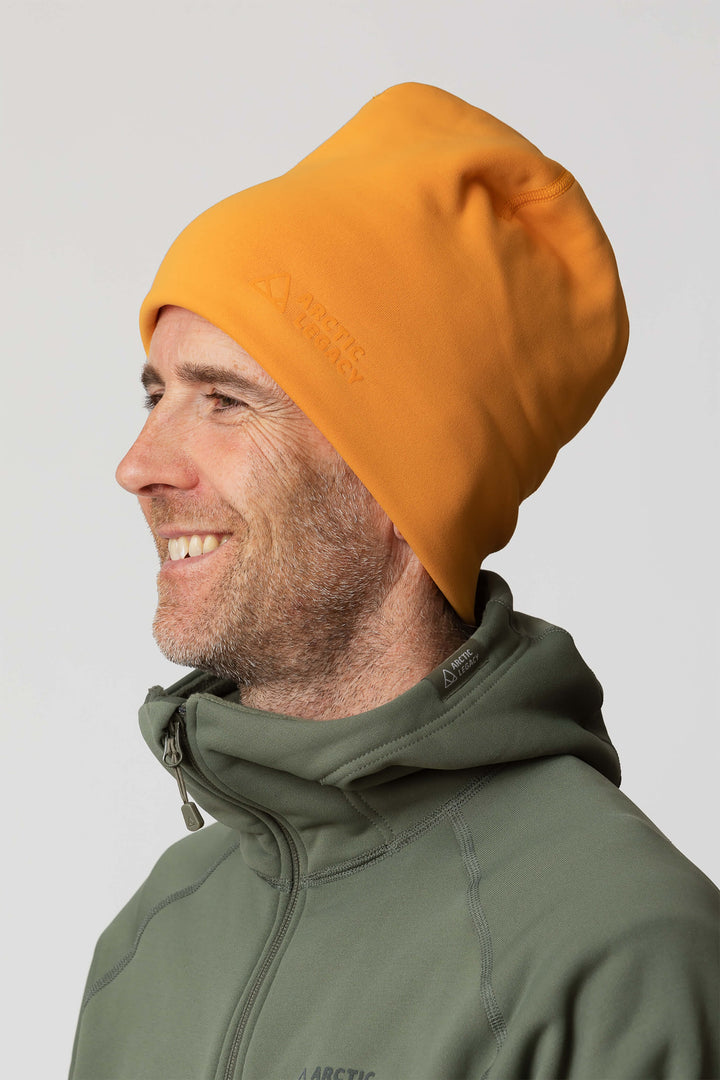 Orange yellow fleece hat - side view of the Arctic Legacy Nova Dual Layer Beanie#color_zinnia